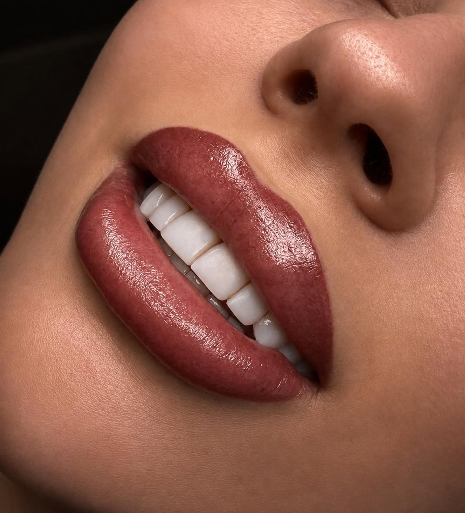 lip tattoo artist applying pigment