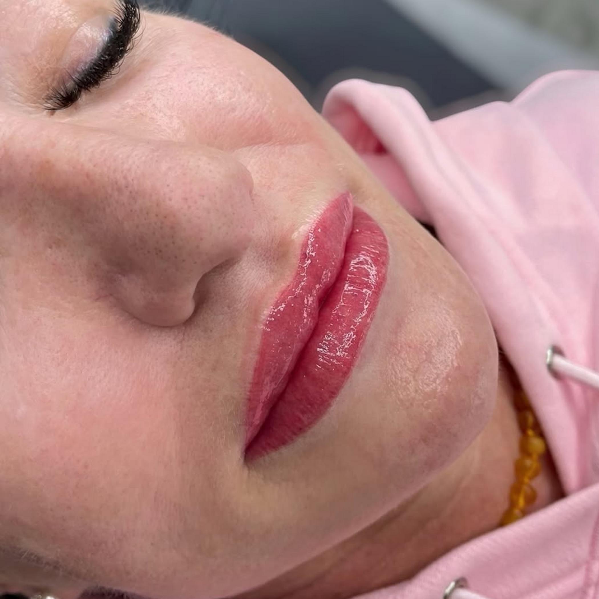 technician performing lip blush treatment